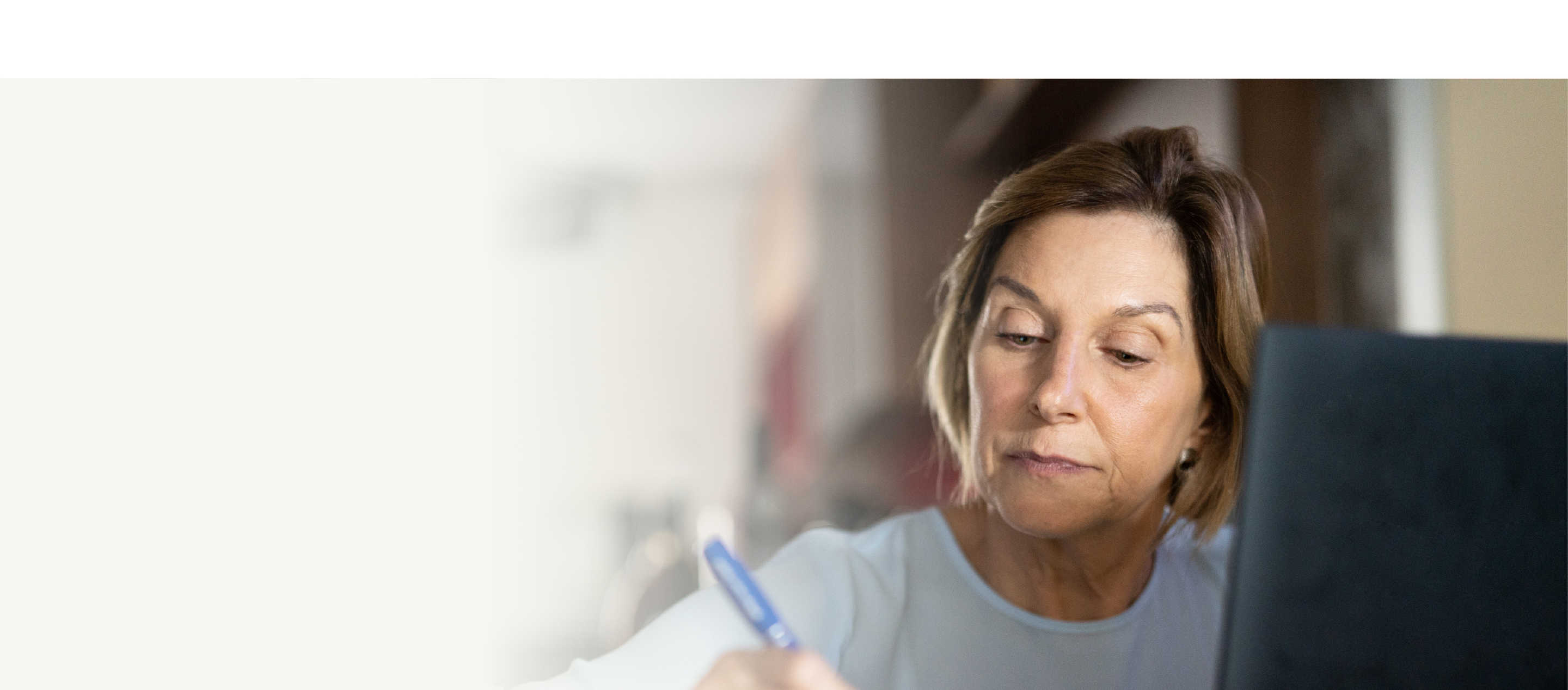 How it works hero, image showing a woman writing