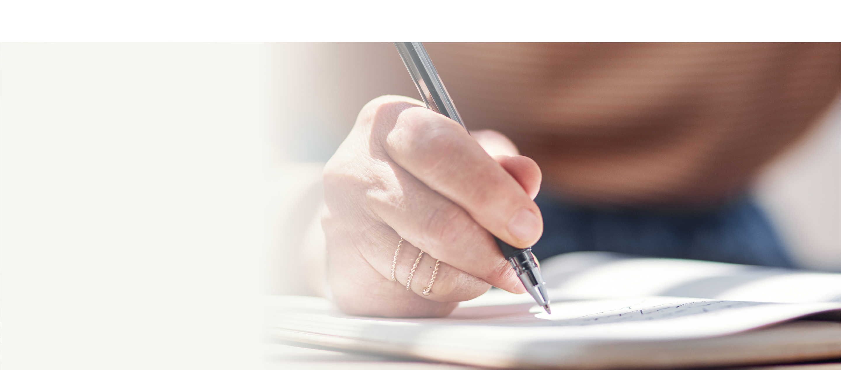 Managing treatment hero, image of a person writing in a book