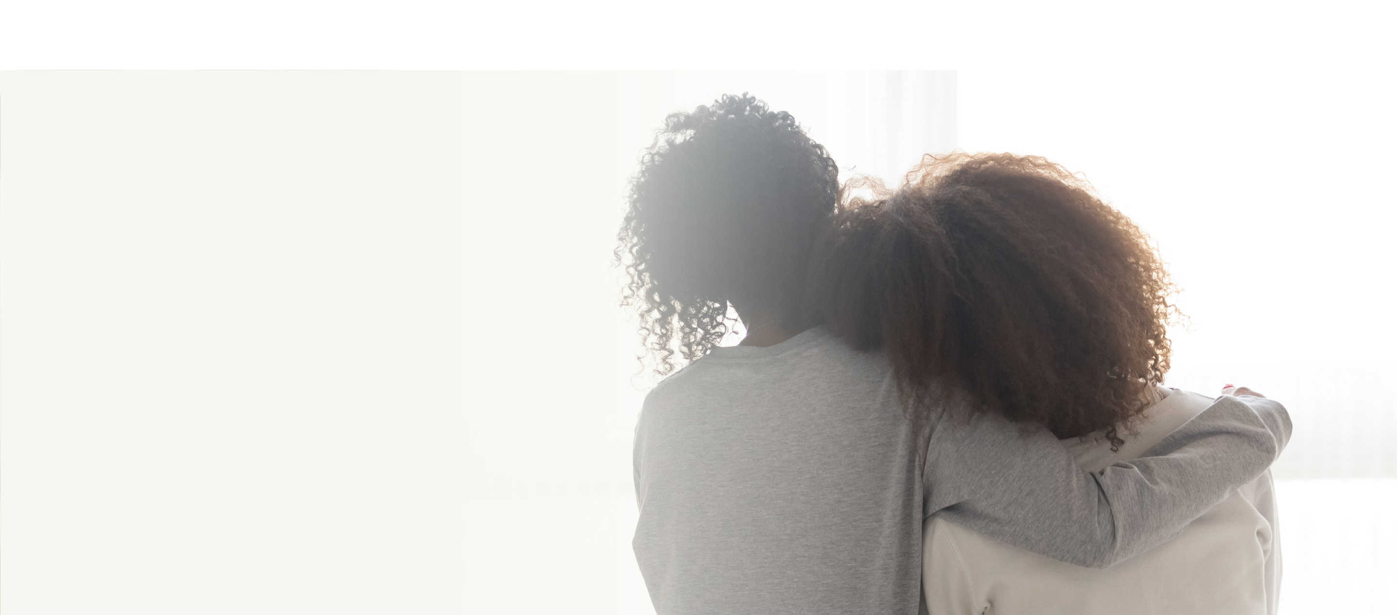 Caregiver hero, image of two women with their backs to the camera