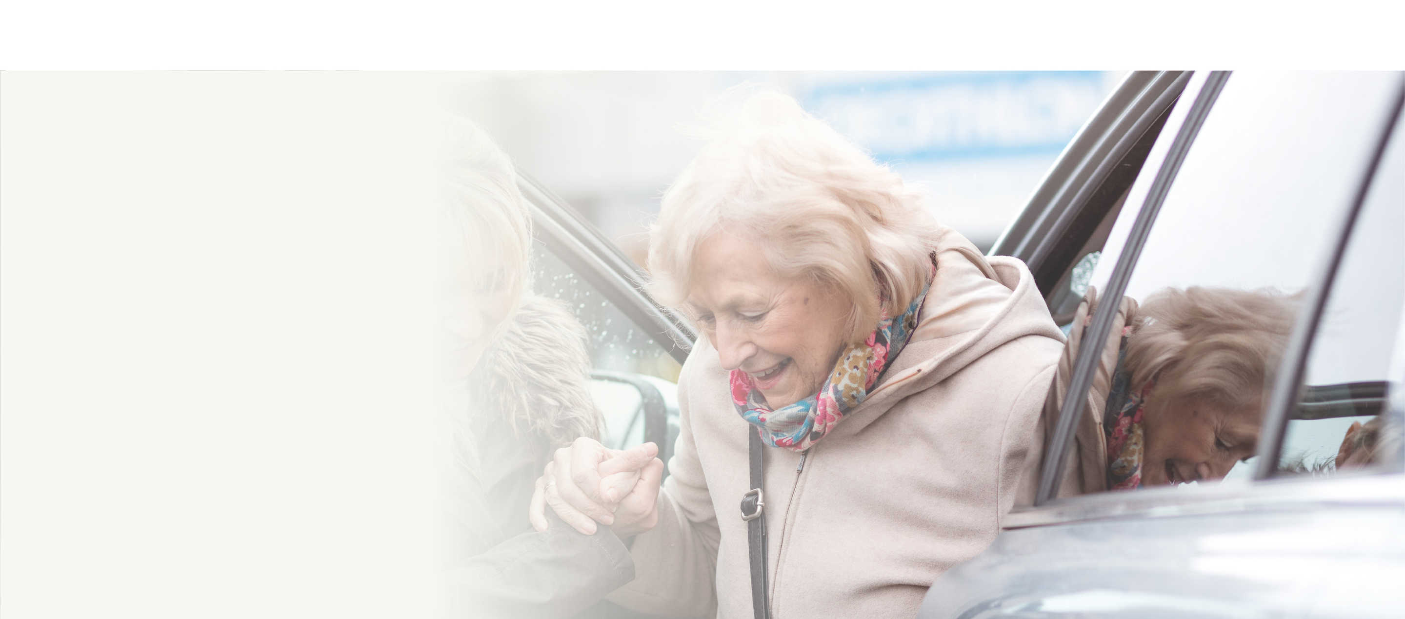 Support hero, image of woman being helped out of a car