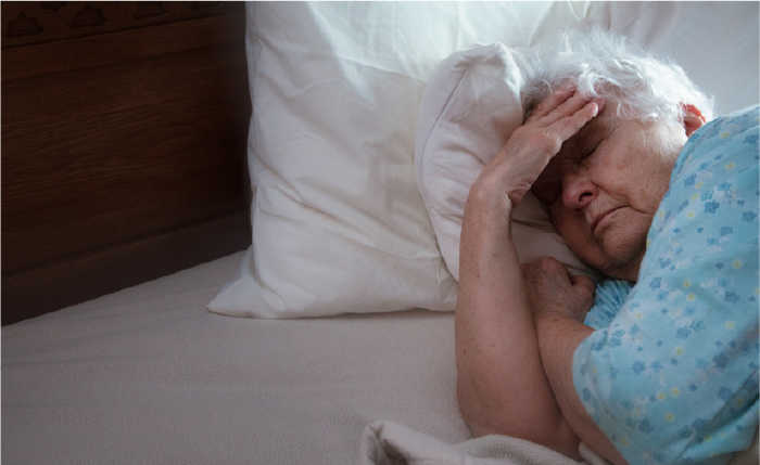 Side effects, image showing a woman in bed